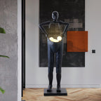 Man Carrying Pants Statue Floor Lamp