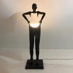 Man Carrying Pants Statue Floor Lamp